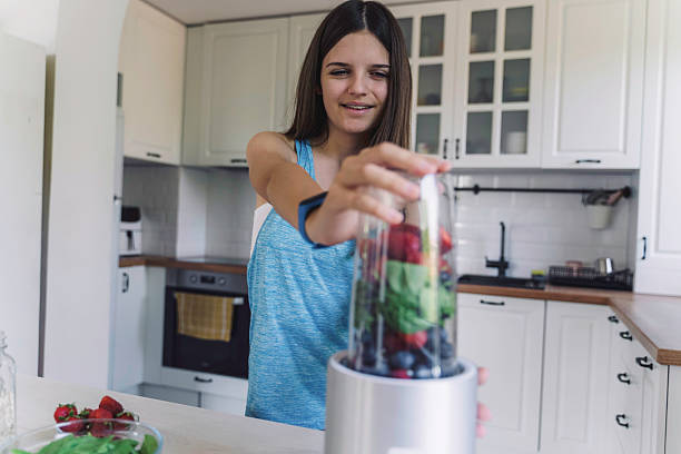 istock Preparing Smoothie with Fresh Fruits and Greens 2224887730