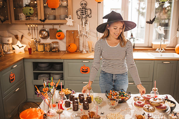 istock Woman preparing food table for Halloween 2224888393