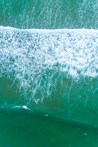 istock Minimalist Ocean Wave Wallpaper in Teal and White. Aerial top down drone view 2224894101