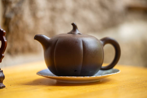 istock Elegant Purple Clay Teapot with a Pumpkin Shape Design 2224895060