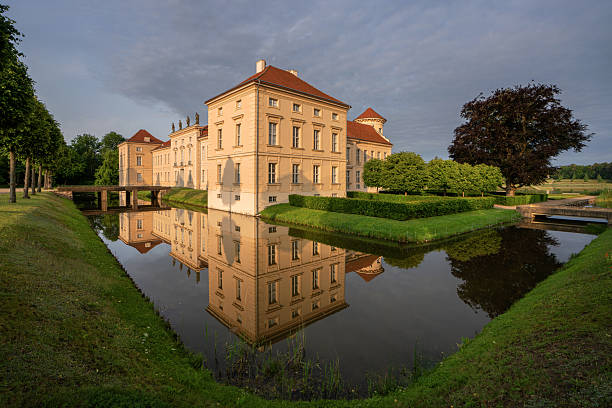 Paretz, Ketzin, Brandenburg in Germany - July 27 2025: two people standing in front of the Paretz Palace