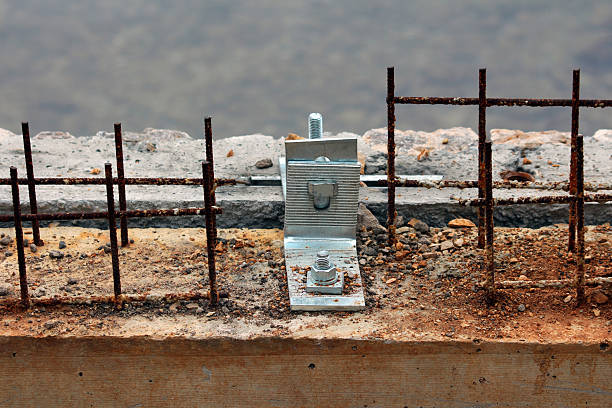 Large concrete block with iron lifting bracket for crane hook