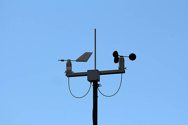 A precision weather station anemometer with a wind vane records wind speed and direction, vital for meteorology, climate monitoring, and environmental data collection