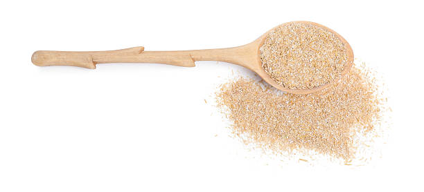 istock Spoon with oat bran isolated on white, top view 2224897660