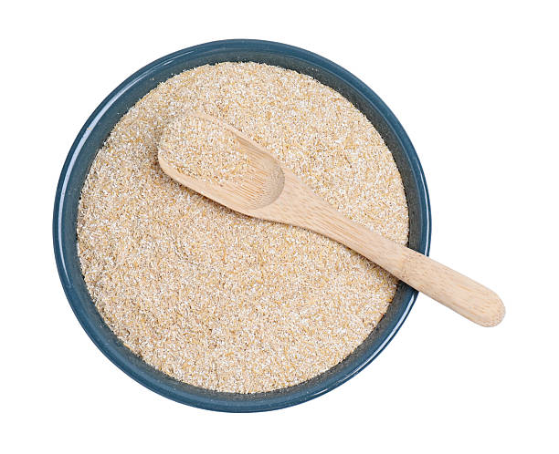 istock Oat bran in bowl and spoon isolated on white, top view 2224897662