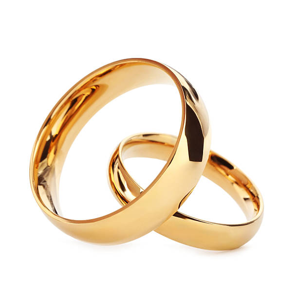 istock Beautiful golden wedding rings isolated on white 2224898378