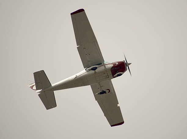 istock airplane flying through a cloudy sky 2224900999