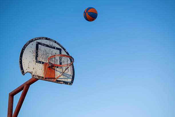 istock Basketball on its way to rim 2224901223