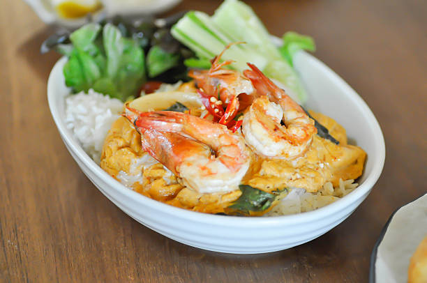 creamy omelet or omelet or omelette or fried egg with shrimp and squid or seafood omelette and rice for serve