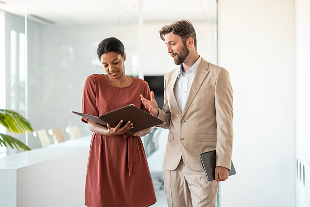 istock Business Colleagues Discussing Documents in a Modern Office 2224904688