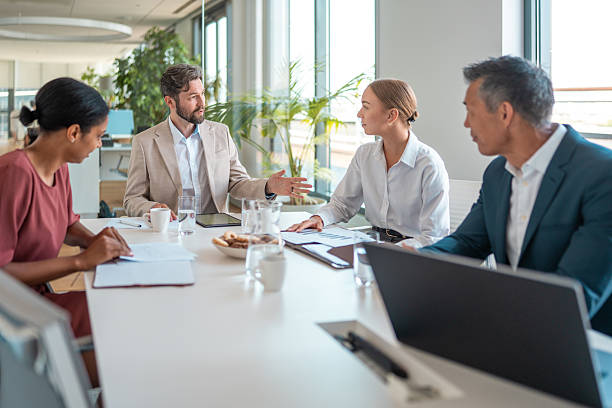 istock Diverse Financial Team Engaged in Modern Office Discussion 2224904732