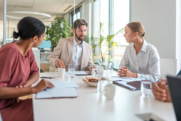 istock Diverse Financial Experts Engaged in Modern Boardroom Discussion 2224904765