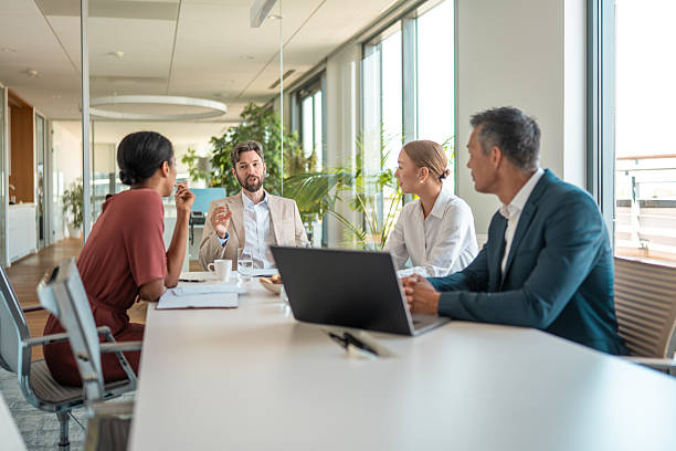 istock Diverse Financial Experts Engaged in Modern Boardroom Discussion 2224904779