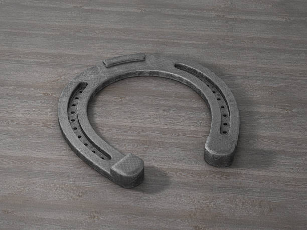 istock Horseshoe on wooden background 2224905339