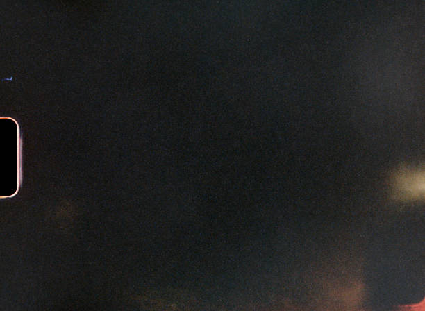 Dark textured background with light leaks, film grain, and a subtle vignette effect