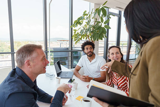 istock Diverse Coworkers Engaged in Creative Office Discussion 2224907418