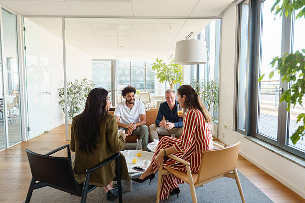 istock Cheerful Diverse Team Collaborating in Office Lounge 2224907487
