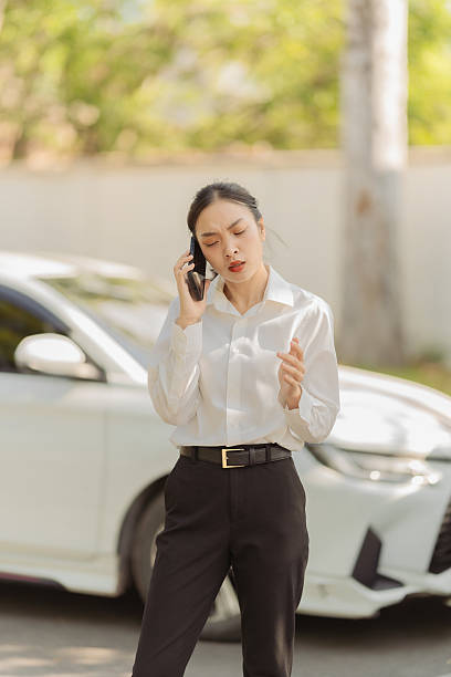 istock Asian woman calling insurance agent for help, fix car problem, help, emergency car repair 2224908081