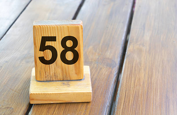 Wooden priority number 58 on a plank tab.