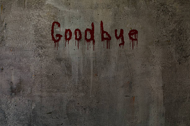 istock Art shabby grey plastered wall with bloody lettering Goodbye, copy space. 2224909752
