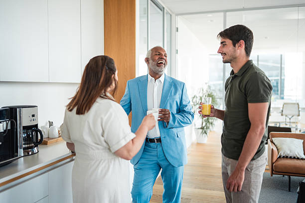 istock Diverse Executives Sharing Lively Conversation in Office Coffee Space 2224909779