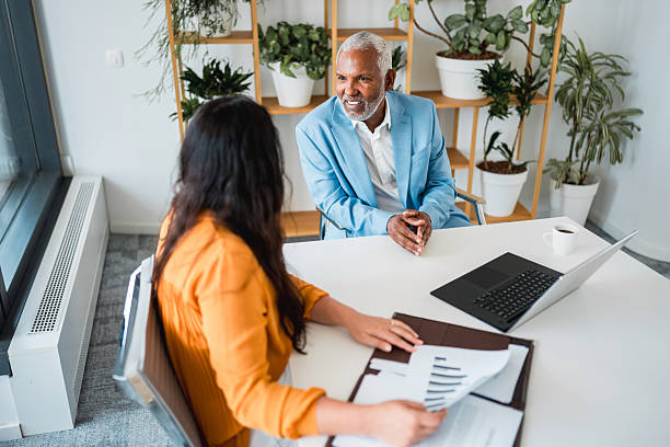 istock Hispanic Executive Engaging with Female Employee in Modern Office 2224909790