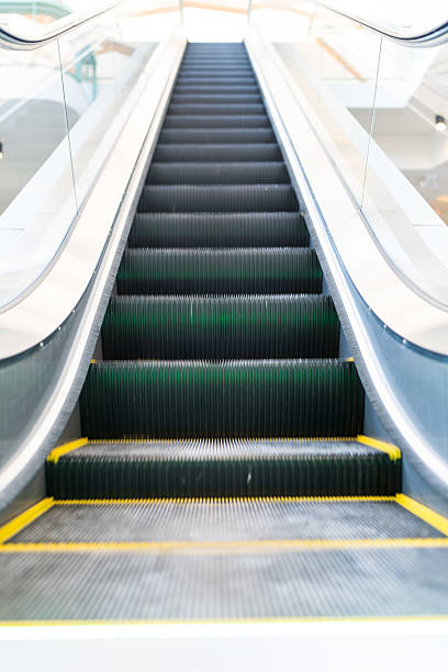 istock Elevator escalator is moving staircase used as transportation between floors 2224913132
