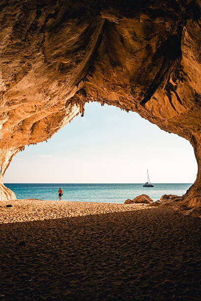 istock View through arch to beach and sea at sunset 2224913812