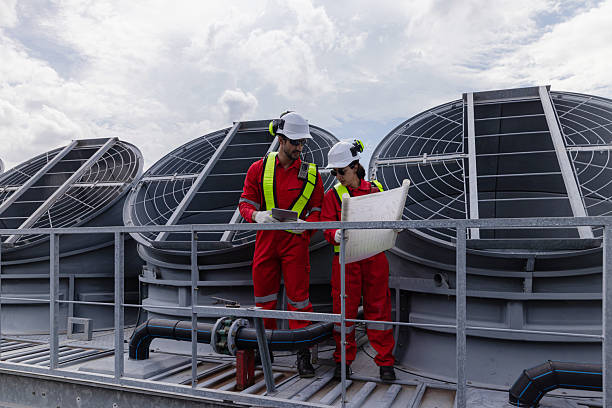 istock Engineers is checking the industry cooling tower air conditioner is water cooling tower air chiller HVAC  of a major building or industrial facility. 2224915643