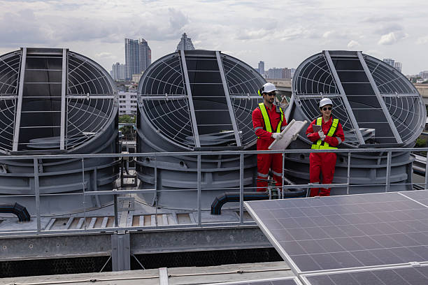 istock Engineers is checking the industry cooling tower air conditioner is water cooling tower air chiller HVAC  of a major building or industrial facility. 2224915675