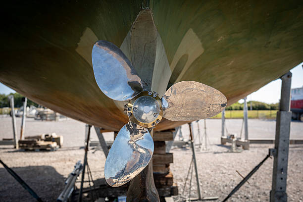 Close up of a polished boat propeller on a dry dock