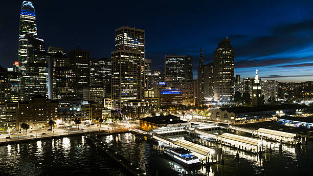 istock Waterfront terminals glow beneath towering skyscrapers. Blue hour view of South Beach district in San Francisco, California. 2224917660