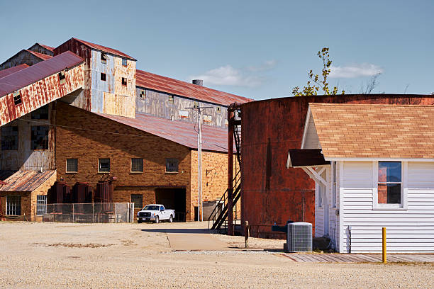 istock Historic Industrial Buildings with Rusted Silos and Warehouse 2224920324