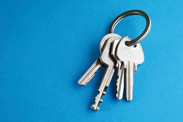 istock Bunch of Keys on blue Background 2224923300