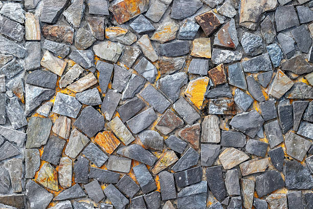 istock Stone wall texture with varied color and shape mosaic patterns 2224923705