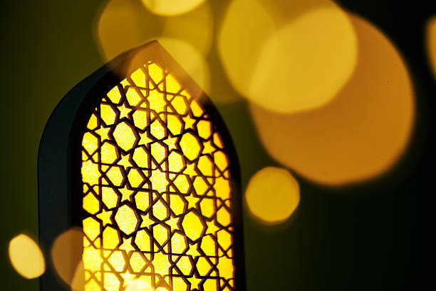 istock islam lantern with bokeh light against green background. 2224926347