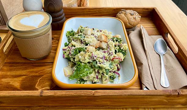Fresh Caesar salad with cafe latte healthy eating lunch