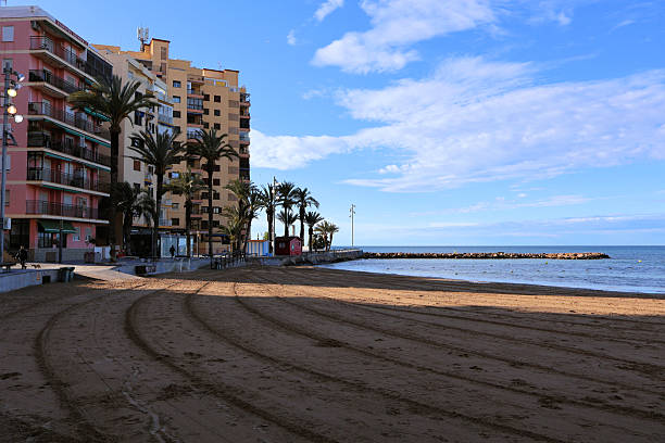 istock Coastal view with urban buildings alongside the sandy beach 2224933986