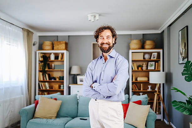 istock Confident entrepreneur smiling with crossed arms in home office 2224934094