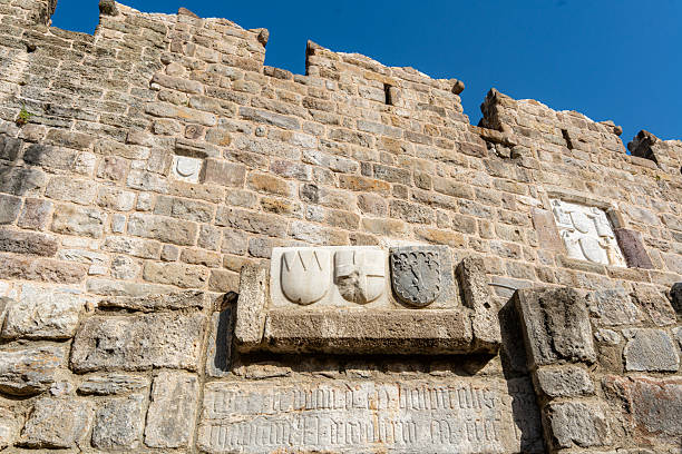 Scottish variant of the Royal Arms of Great Britain, using the same basic elements but with Scottish symbolism, on the wall of a building; Edinburgh, Scotland