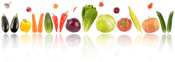 istock Bright healthy vegetables and fruits with light reflection isolated on white 2224940282