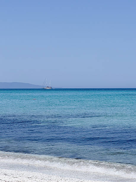 istock Sailing Yacht on Tranquil Sea Under Clear Sky Sardinia 2224945828