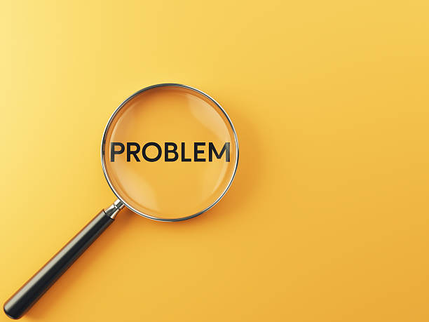 istock Problem wording inside of Magnifying glass on an orange background 2224946670
