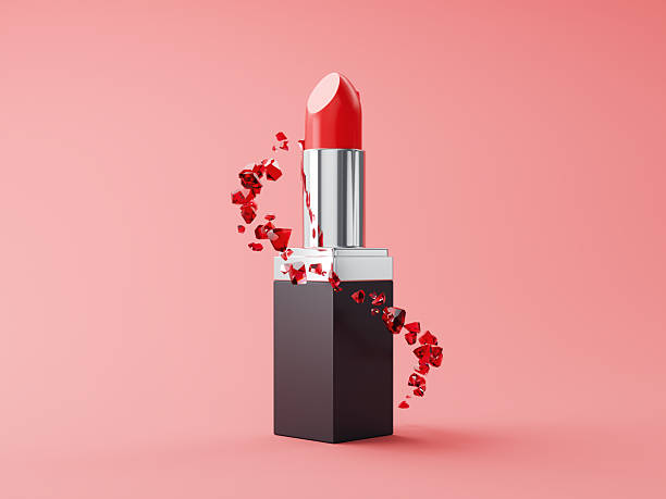istock Red Lipstick And Gems Particles Helix Close-up on Pink Background 2224946772