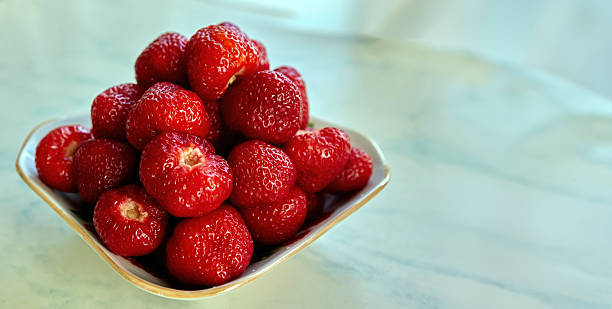 istock Juicy strawberries create a delightful centerpiece, tempting all who pass by. 2224947823