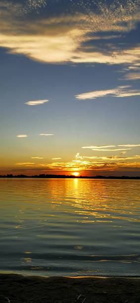 istock Dazzling sunset over calm water lake 2224948884