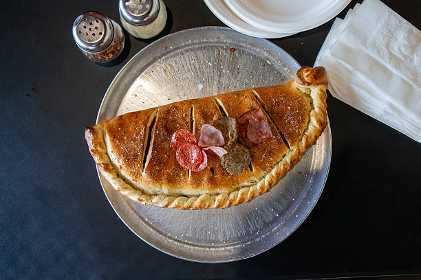 Meat Stromboli filled with cheese and tomato sauce