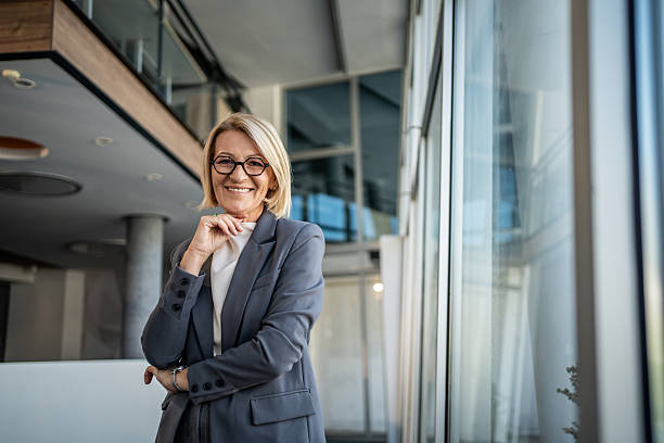 istock Successful senior businesswoman smiling in modern office building 2224950607
