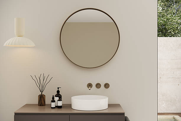 istock Modern Japandi bathroom with double floor-to-ceiling windows, a floating vanity, and a freestanding bathtub. Earthy accessories and soft lighting enhance the warm and welcoming atmosphere. 3D visualization. 2224954581