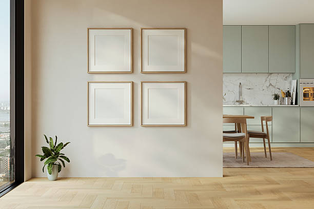 istock Modern interior design of apartment, kitchen, dining room with table and chairs, empty living room with four empty square frames, panorama. 2224955049